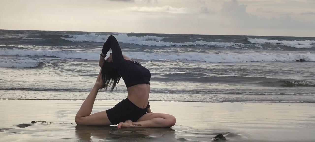 A calm yoga posture by the ocean